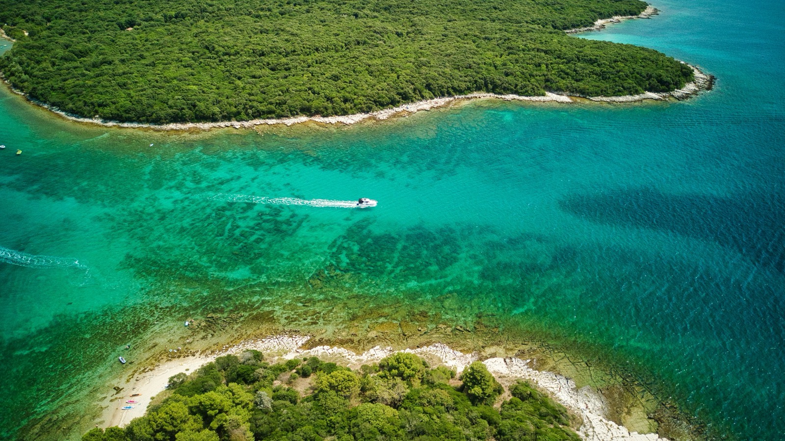 Rental boats anchored in a hidden bay near Rovinj